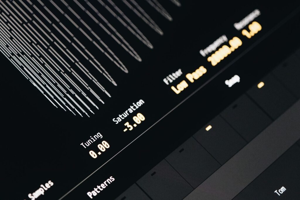 Close-up of a modern digital sound interface screen displaying tuning, saturation, and filter settings.