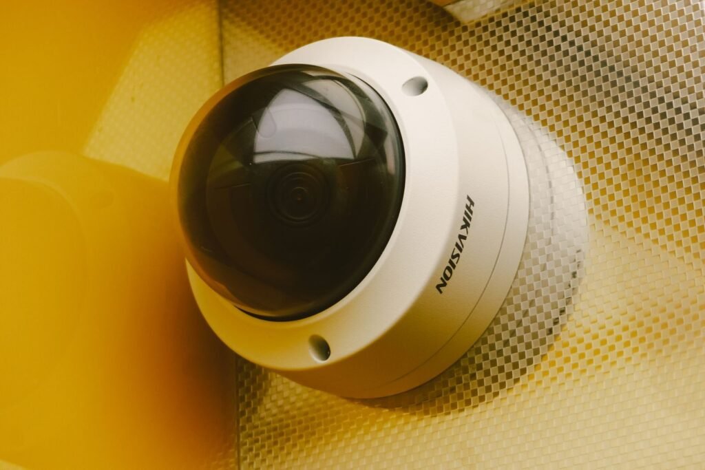 Photo by Atypeek Dgn From below of modern camera for recording audio and video in building for security and protection