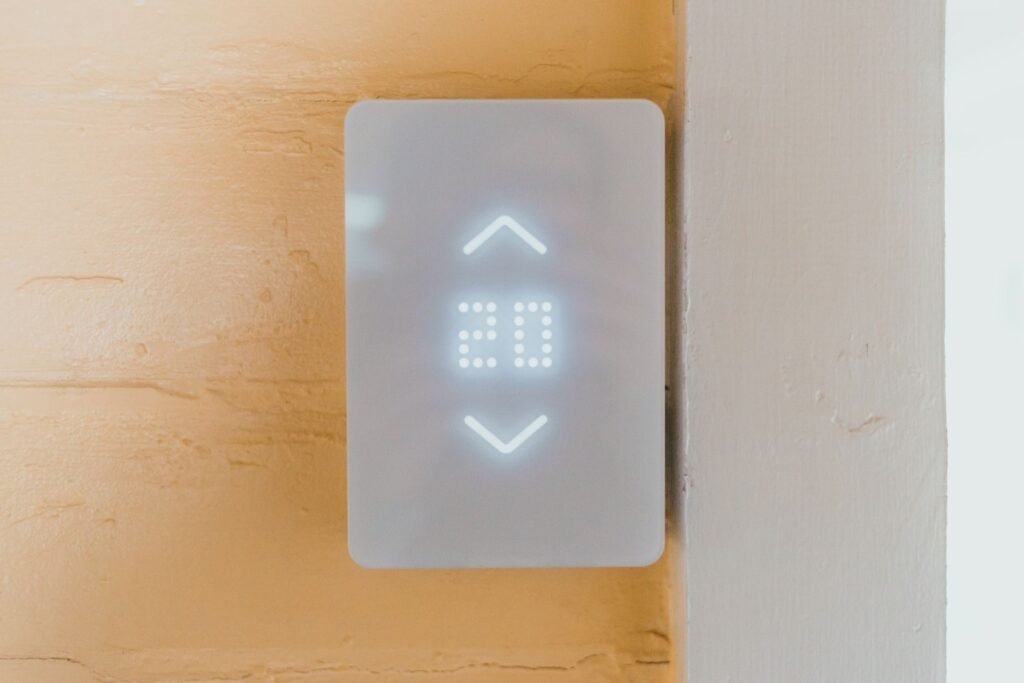 Close-up of a contemporary elevator call panel featuring a bright LED number display.