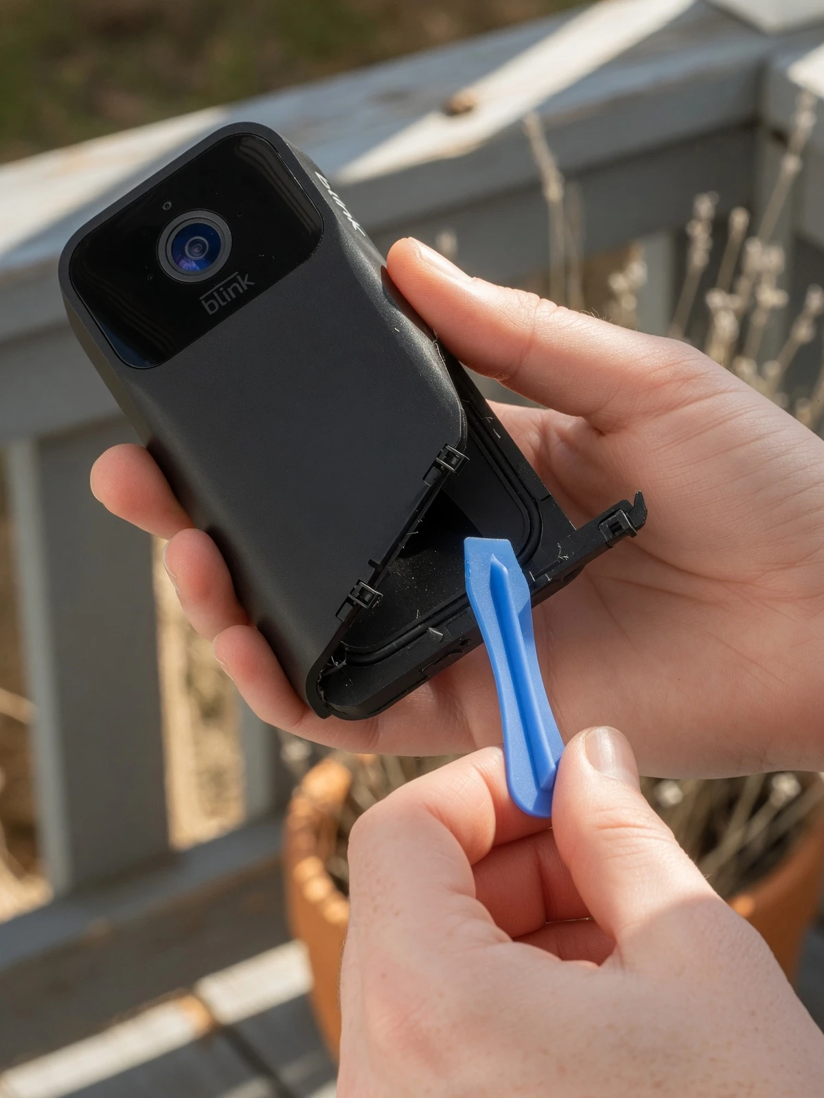 Removing Blink video doorbell back cover using the release tool