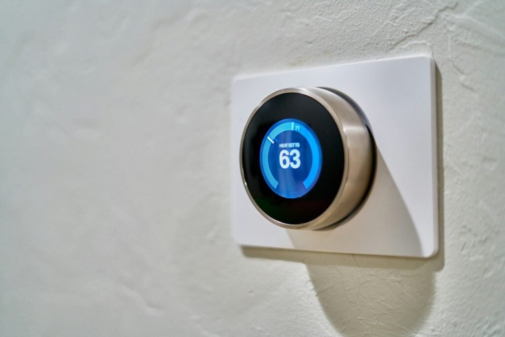 Photo by Dan LeFebvre gray Nest thermostat displaying at 63